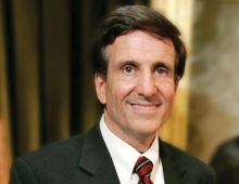 Randy Holland ’69—Judicial Ethicist is a man with brown hair who smiles. 